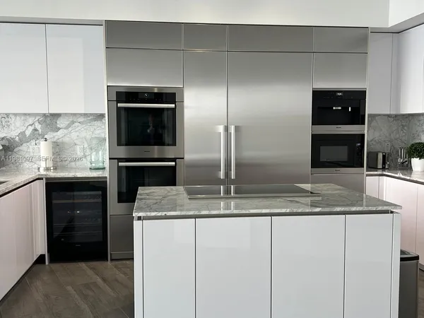 a living room with furniture tv and a large window