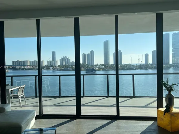 a spacious bedroom with a bed and a couch