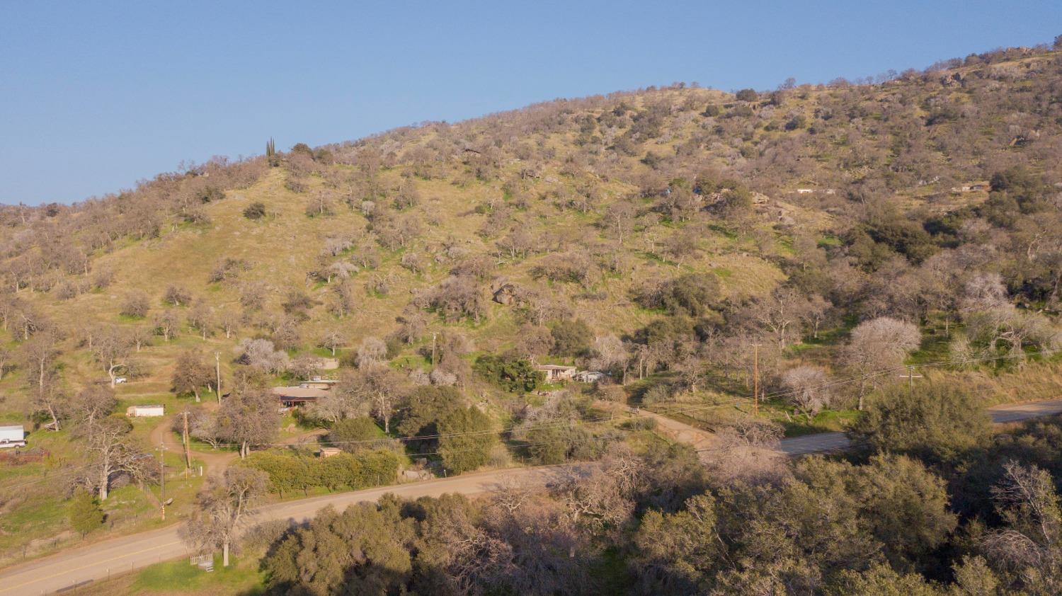 39428 Squaw Valley Road Squaw Valley, CA 93675 - Photo 14 of 14 a view of a dry yard with mountains in the background