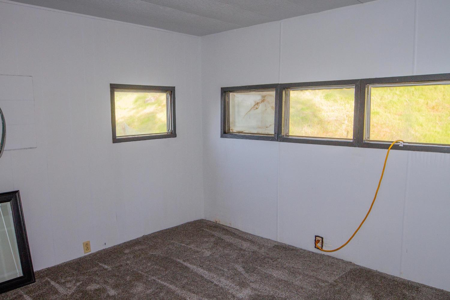 39428 Squaw Valley Road Squaw Valley, CA 93675 - Photo 5 of 14 a view of empty room with window