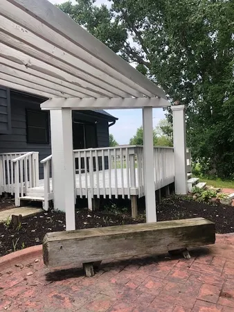 a view of a house with a wooden fence