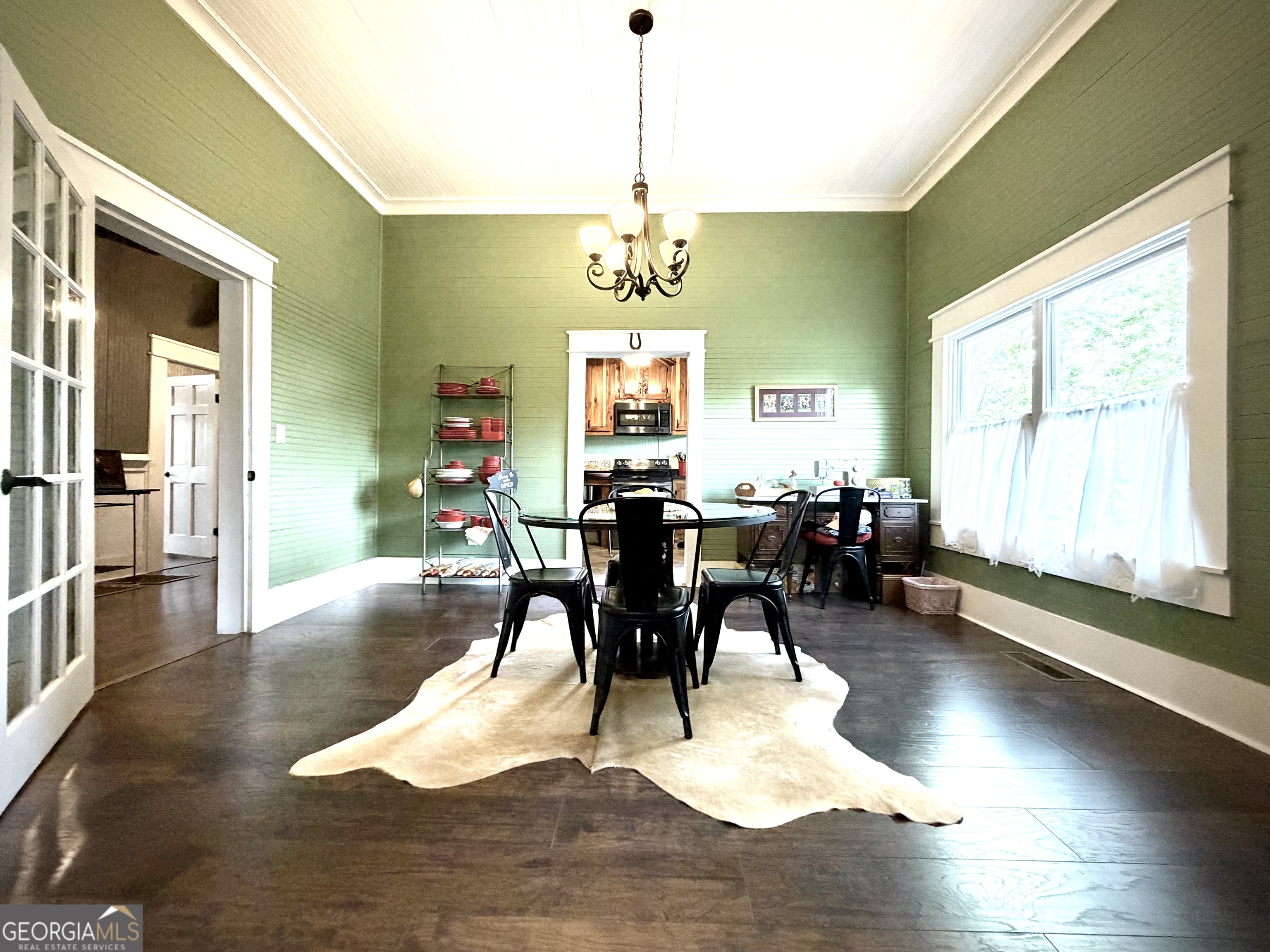 629 Bobby Fortner Road Kite, GA 31049 - Photo 12 of 63 a view of a dining room with furniture window and wooden floor