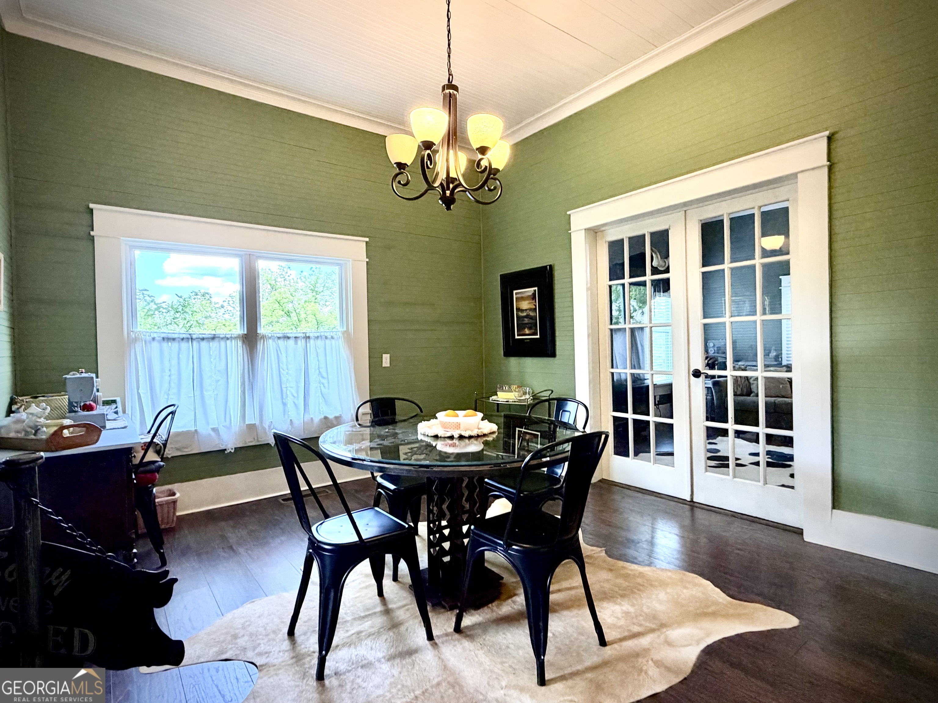 629 Bobby Fortner Road Kite, GA 31049 - Photo 13 of 63 a dining room with furniture a rug and wooden floor