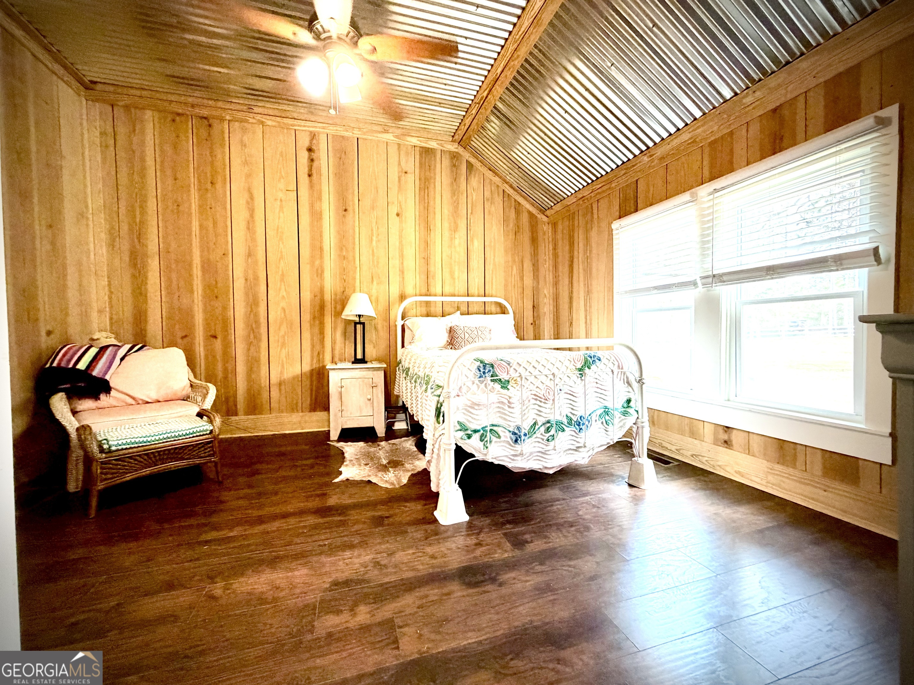 629 Bobby Fortner Road Kite, GA 31049 - Photo 17 of 63 a living room with a bed furniture and a large window