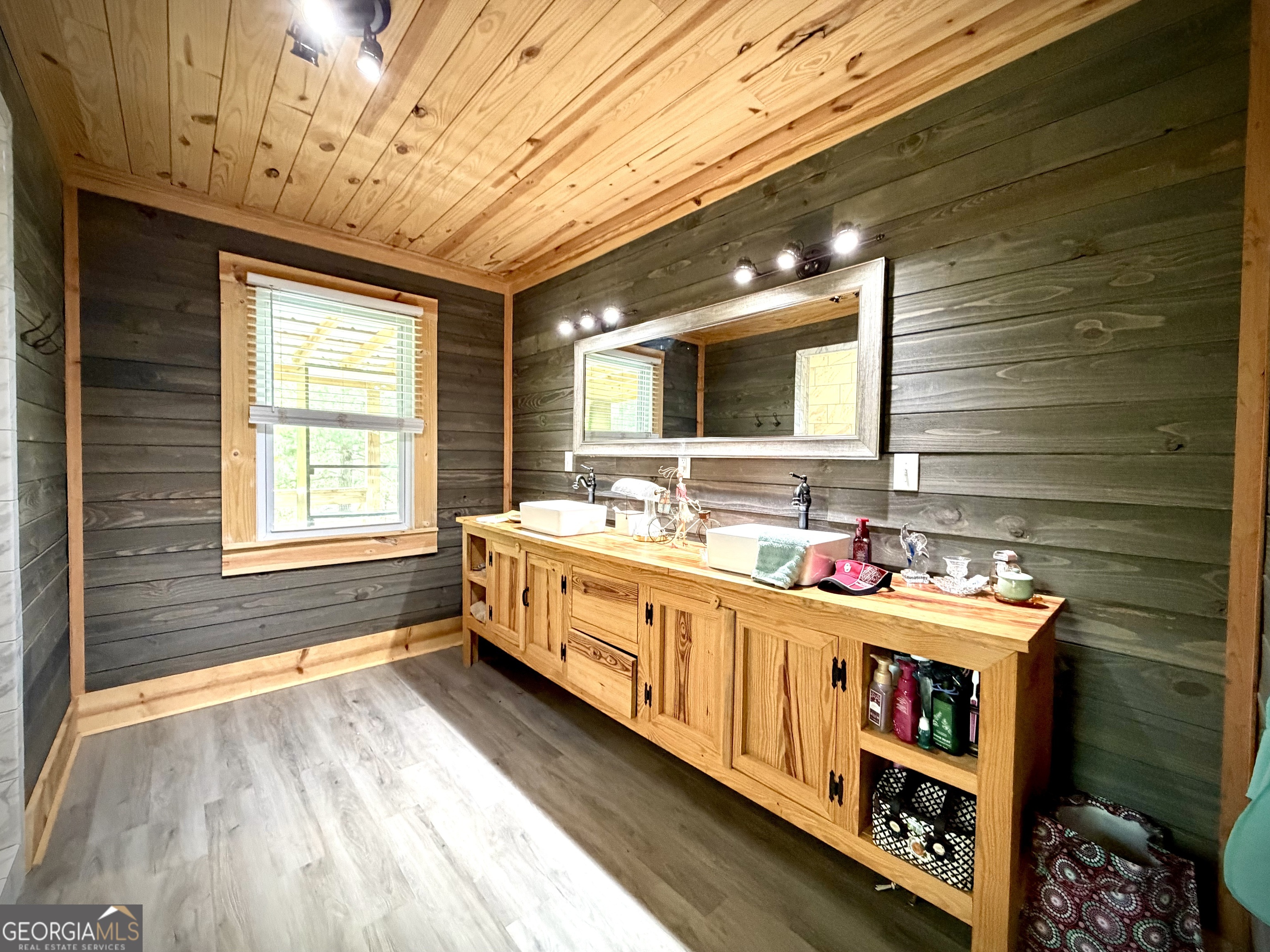 629 Bobby Fortner Road Kite, GA 31049 - Photo 18 of 63 a bathroom with a double vanity sink and a large mirror