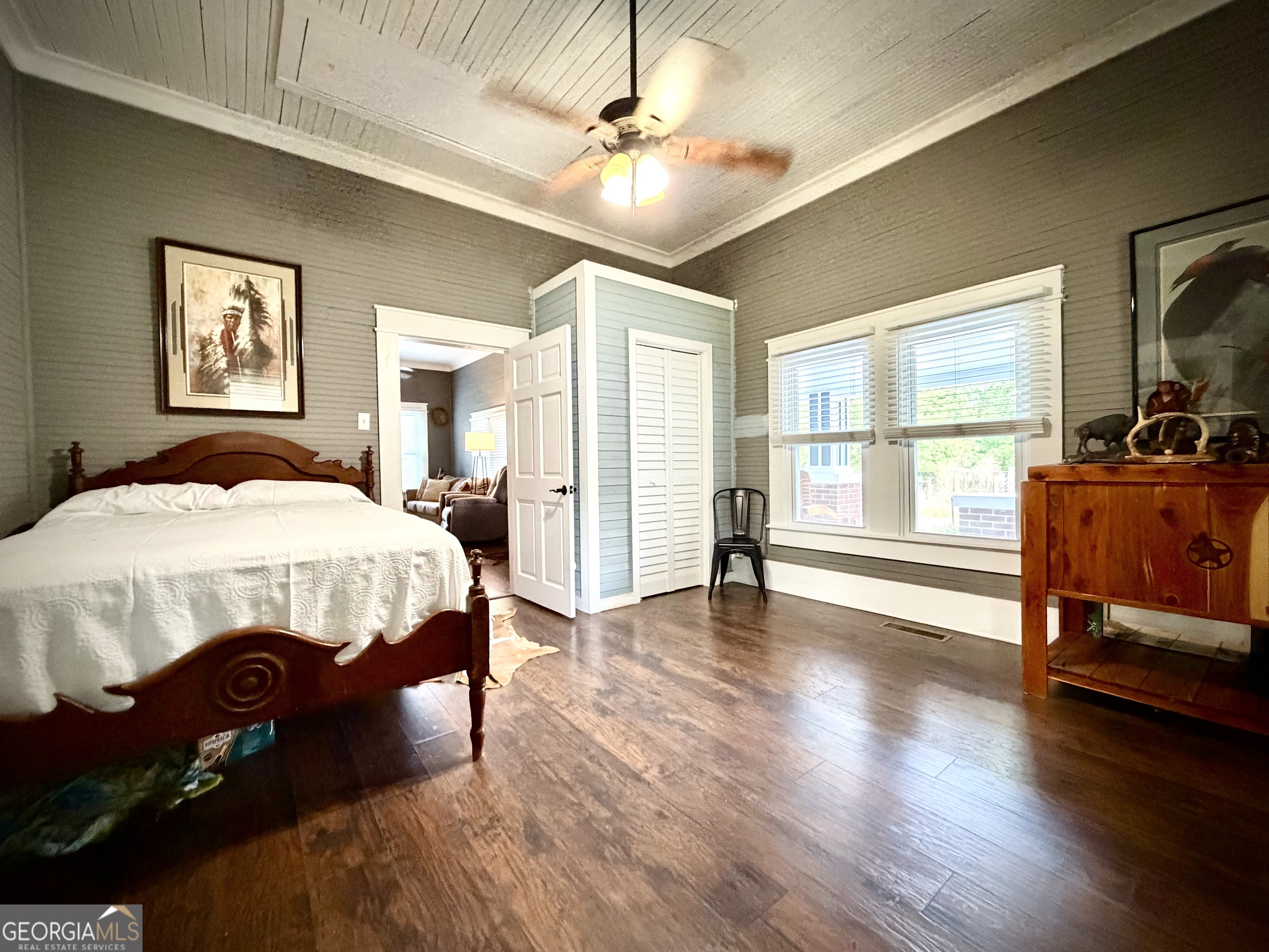 629 Bobby Fortner Road Kite, GA 31049 - Photo 24 of 63 a bedroom with a bed and wooden floor