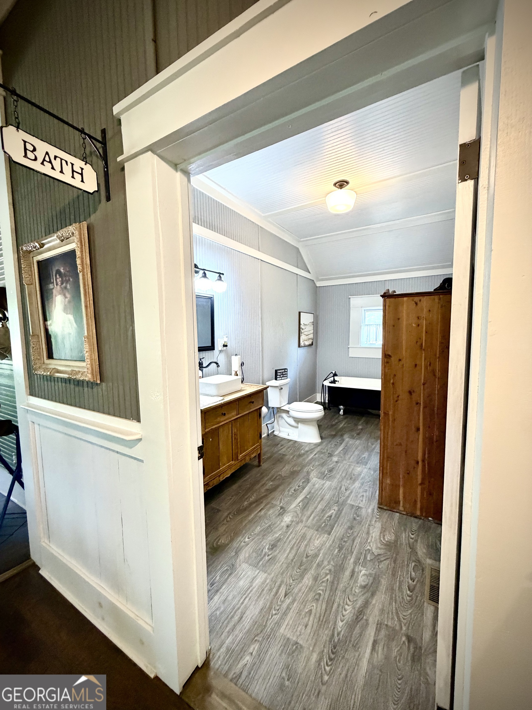 629 Bobby Fortner Road Kite, GA 31049 - Photo 30 of 63 a view of a hallway with wooden floor and a living room