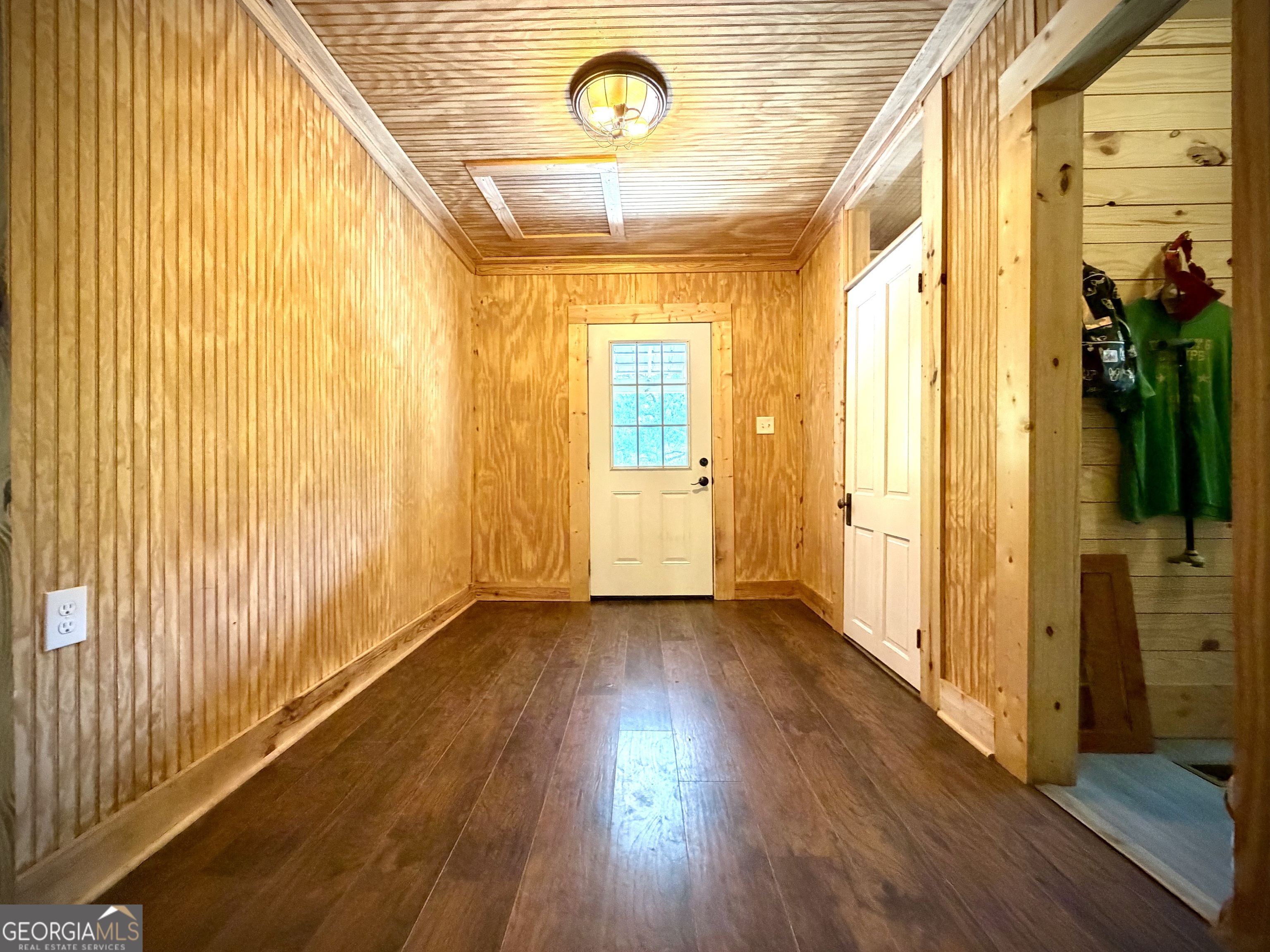 629 Bobby Fortner Road Kite, GA 31049 - Photo 35 of 63 a view of empty room with wooden floor and fan