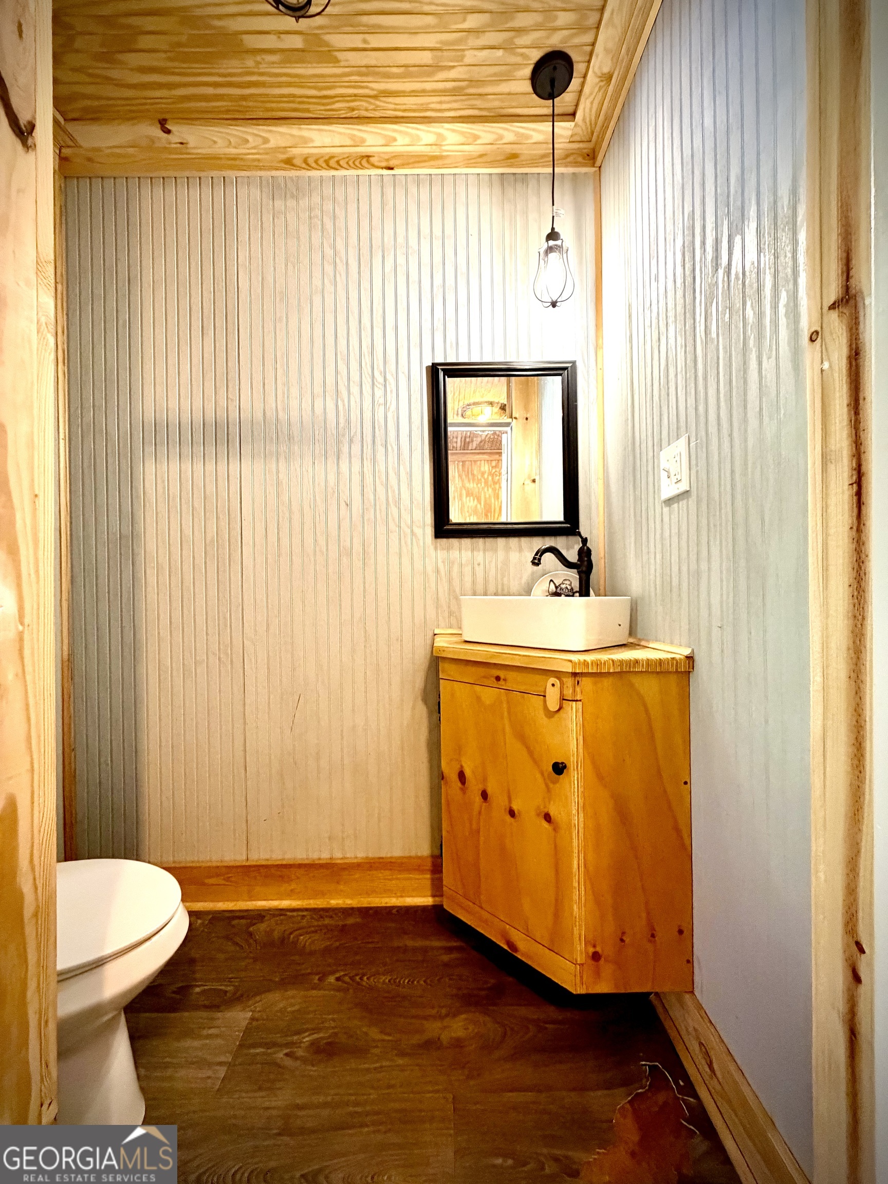 629 Bobby Fortner Road Kite, GA 31049 - Photo 36 of 63 a bathroom with a sink a toilet and shower curtain
