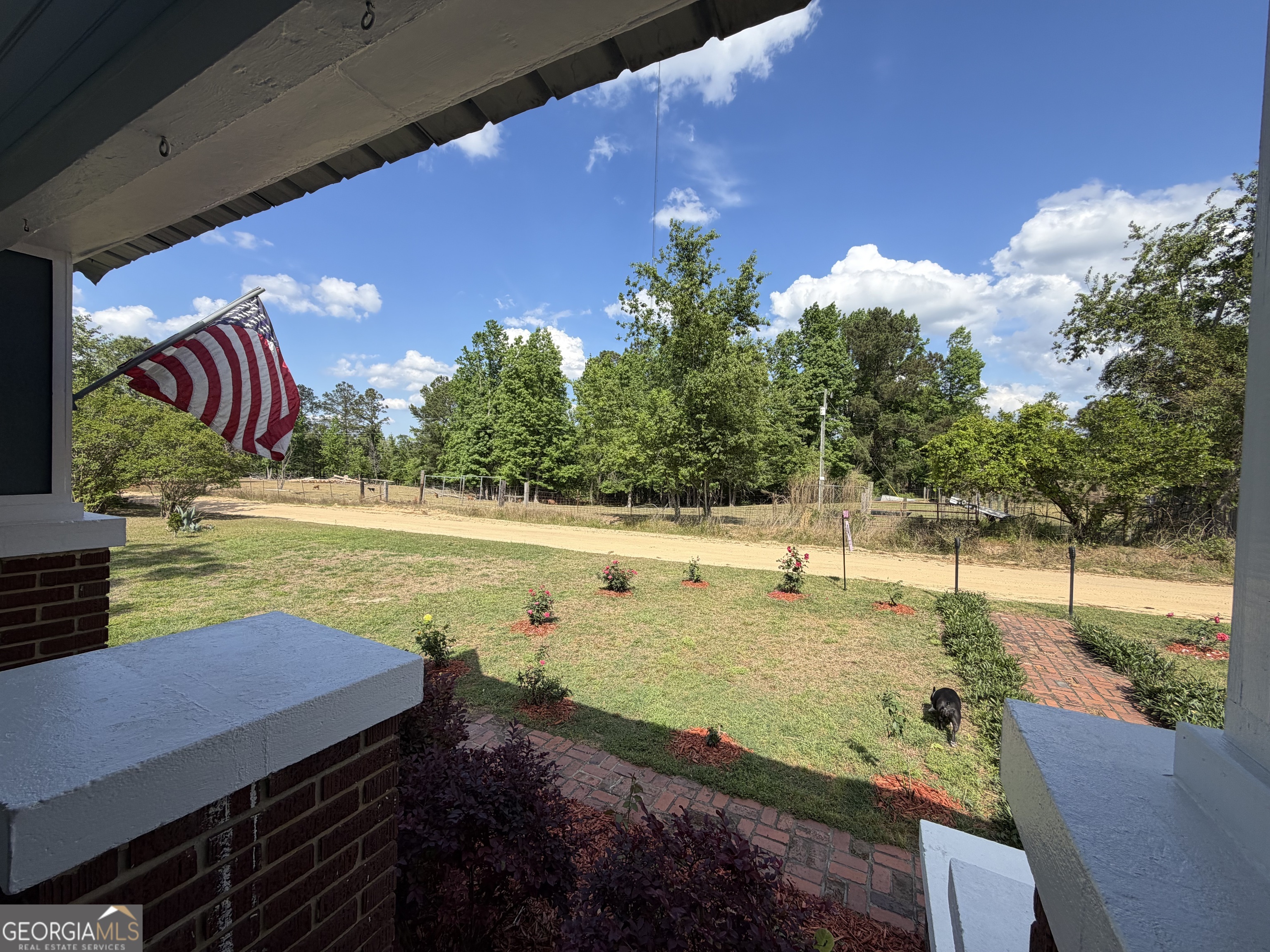 629 Bobby Fortner Road Kite, GA 31049 - Photo 42 of 63 a view of a swimming pool with an outdoor space and seating area
