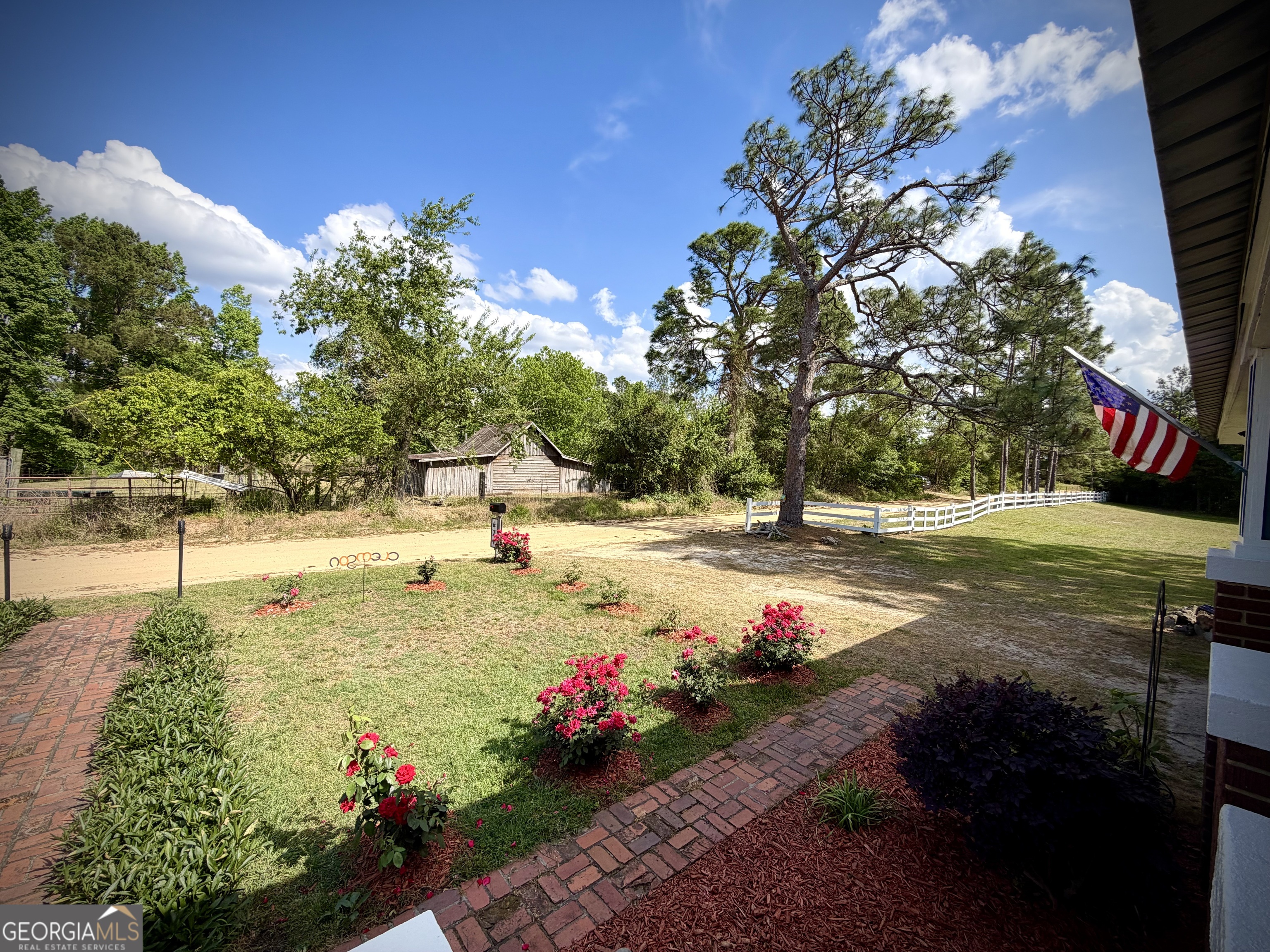 629 Bobby Fortner Road Kite, GA 31049 - Photo 43 of 63 a view of a garden with flowers