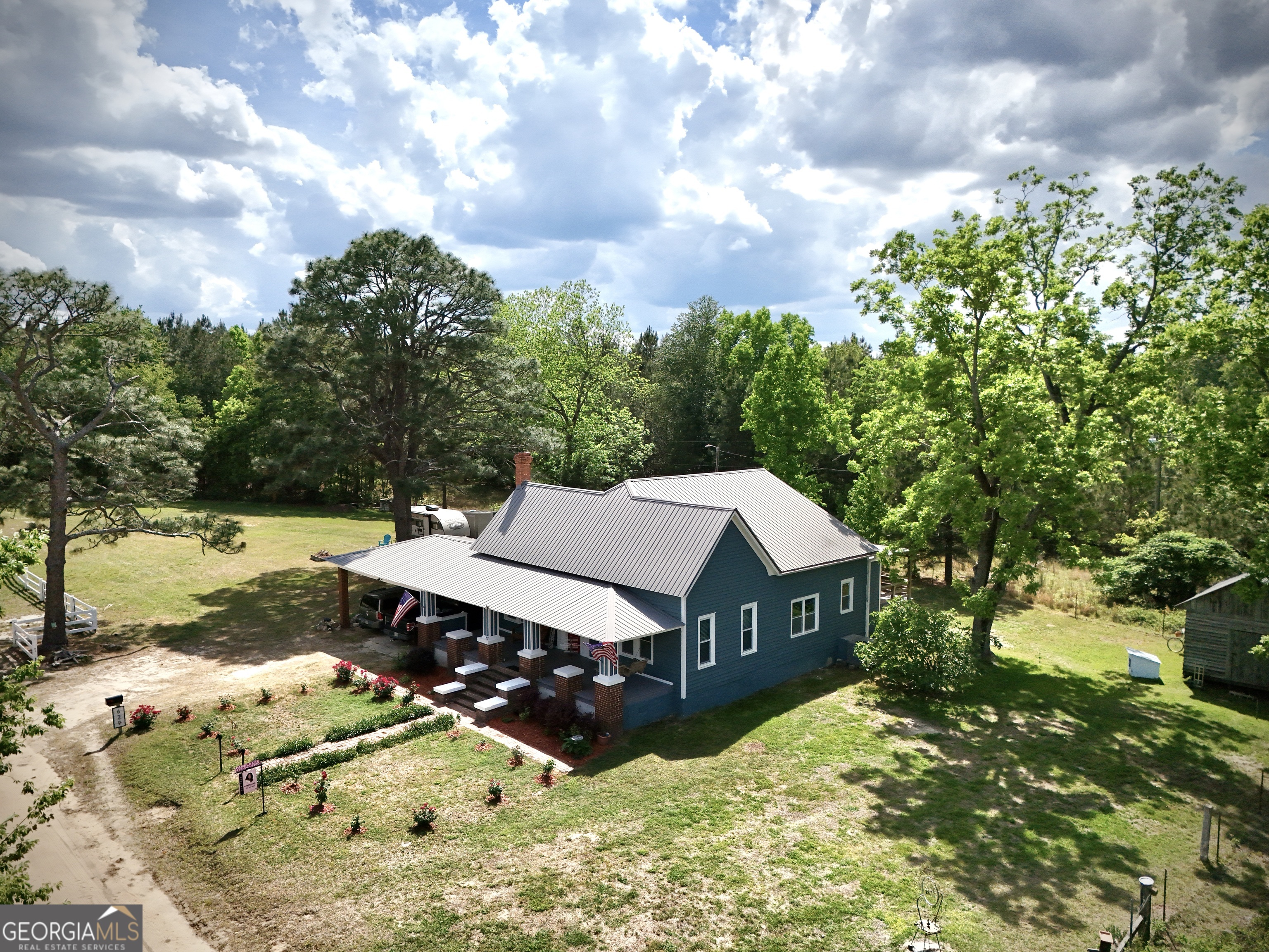 629 Bobby Fortner Road Kite, GA 31049 - Photo 50 of 63 a view of a house with a yard