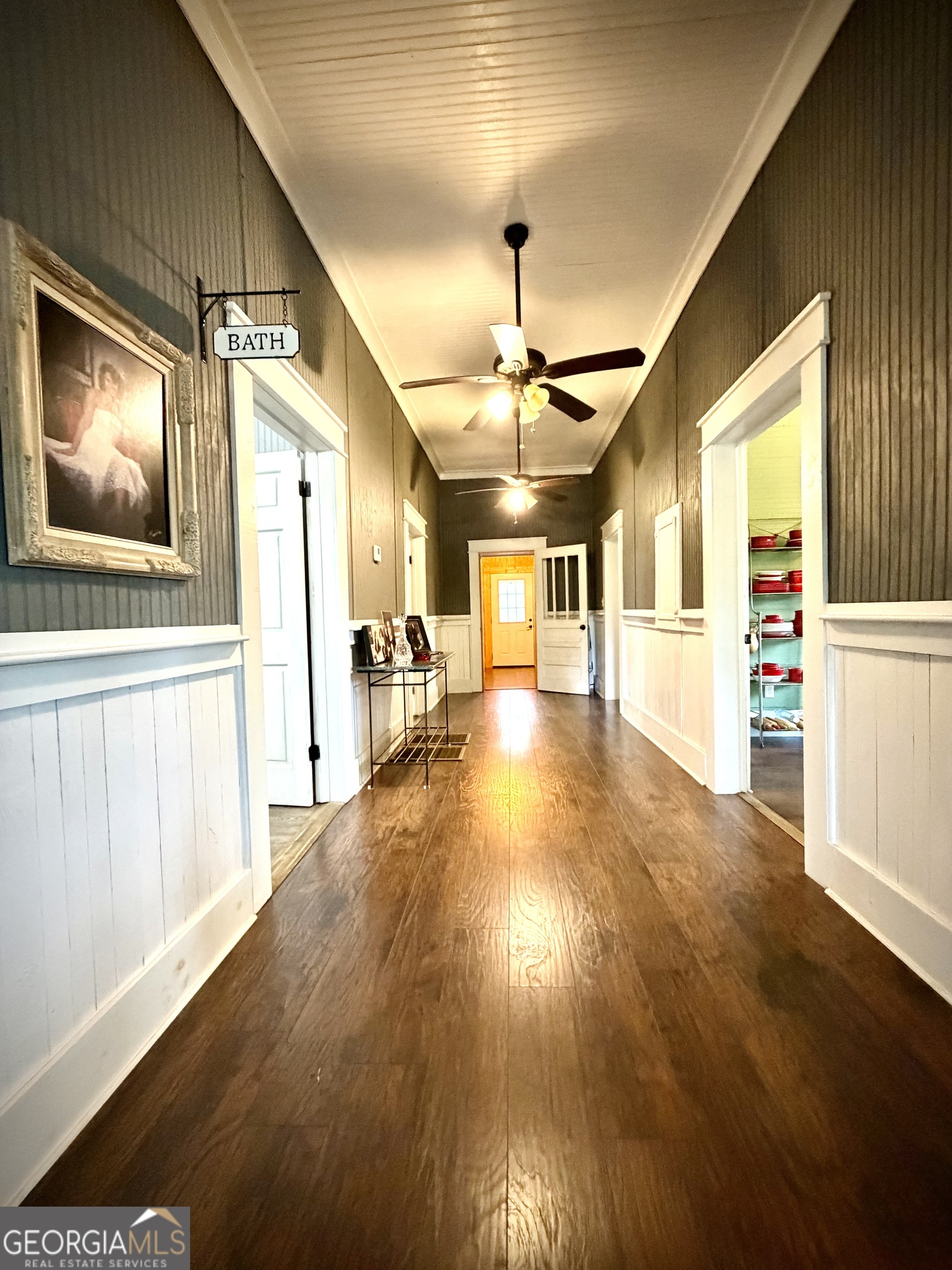 629 Bobby Fortner Road Kite, GA 31049 - Photo 5 of 63 a view of a hallway with wooden floor and a living room