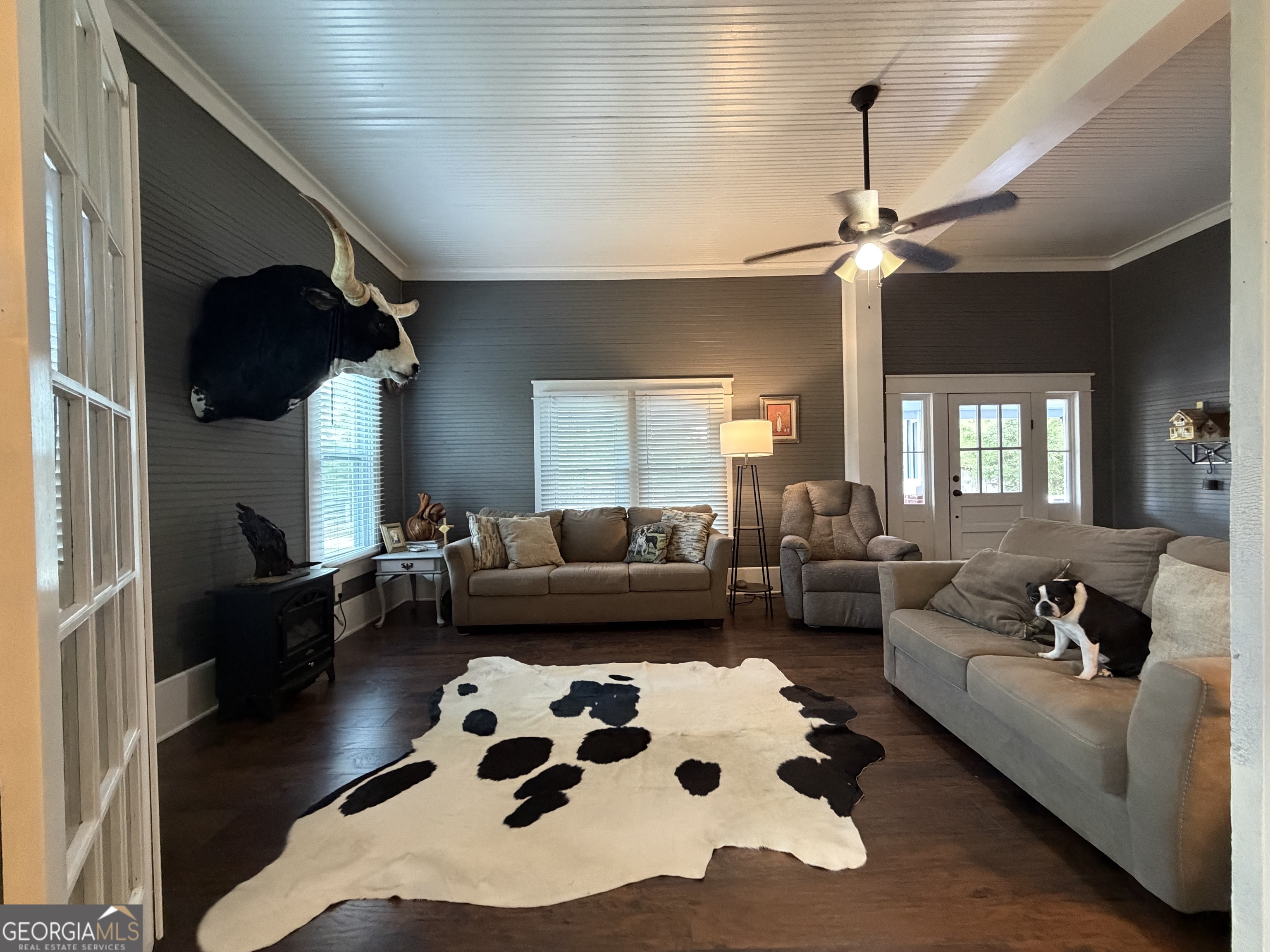 629 Bobby Fortner Road Kite, GA 31049 - Photo 10 of 63 a living room with furniture ceiling fan and a wooden floor