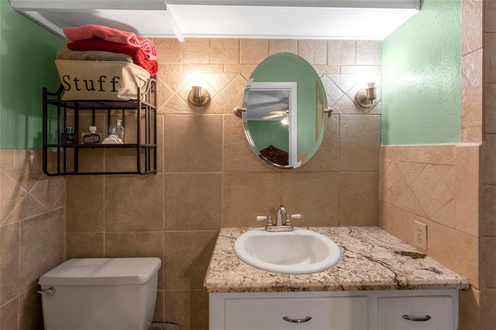 1436 County Road 2320, Unit 1 Como, TX 75431 - Photo 22 of 27 a bathroom with a sink and a mirror