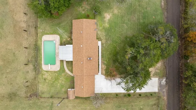 a view of a swimming pool with an outdoor space and seating area