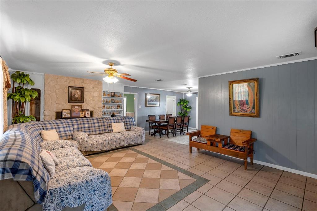 1436 County Road 2320, Unit 1 Como, TX 75431 - Photo 5 of 27 a living room with furniture a dining table and a large window