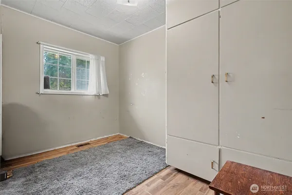 a room with a bed and a window