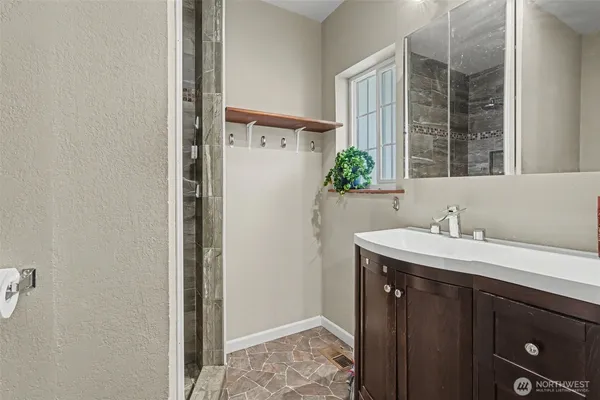 a bathroom with a sink and a mirror