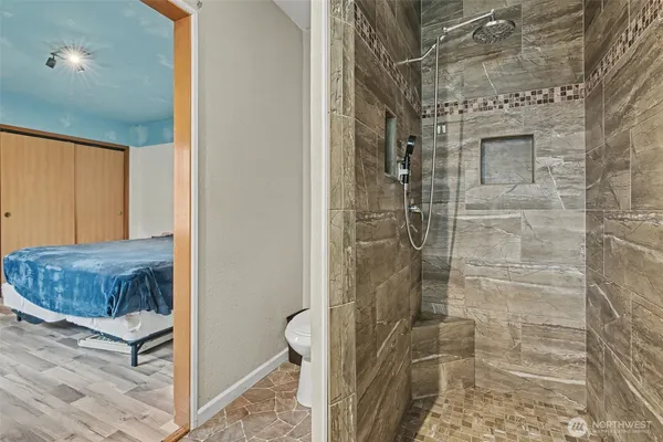a bathroom with a bathtub and a shower