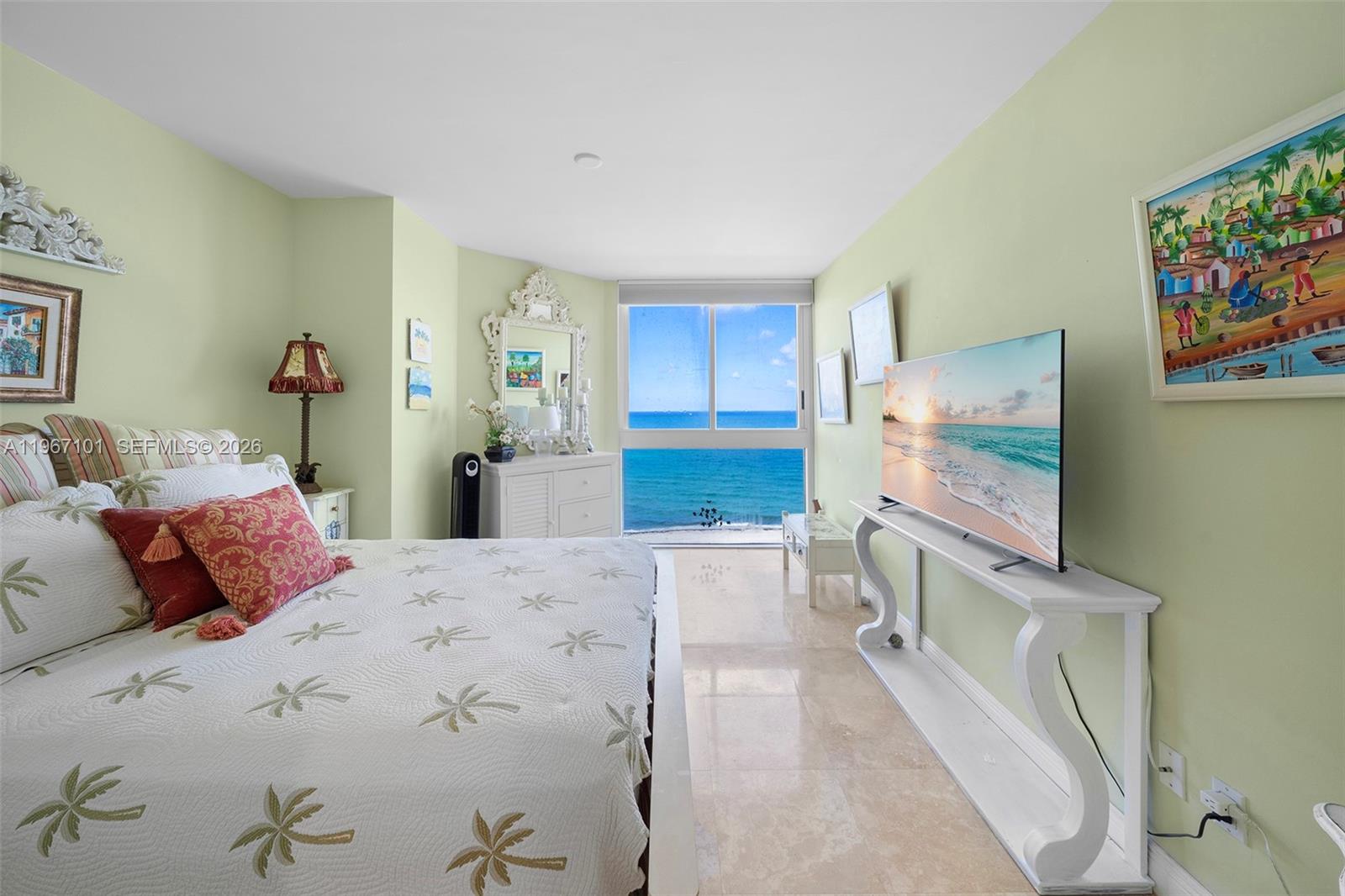 4775 Collins Avenue, Unit 1203 Miami Beach, FL 33140 - Photo 15 of 43 a bedroom with a bed and a flat screen tv