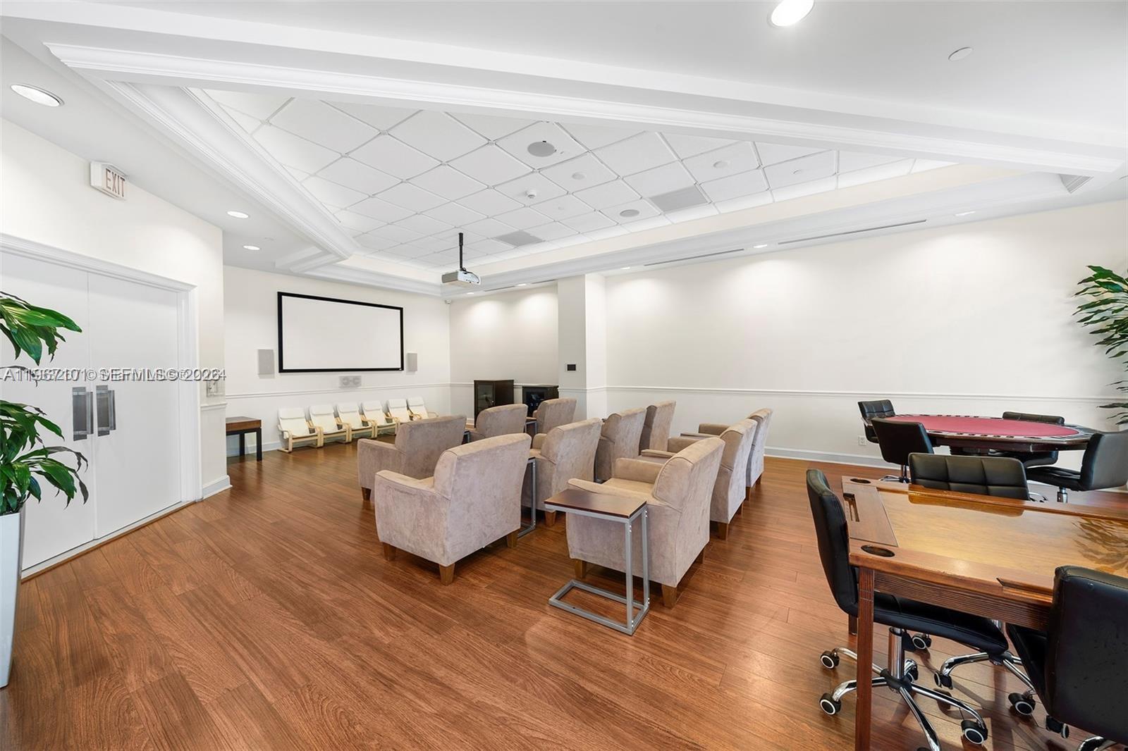 4775 Collins Avenue, Unit 1203 Miami Beach, FL 33140 - Photo 41 of 43 a living room with furniture and a wooden floor