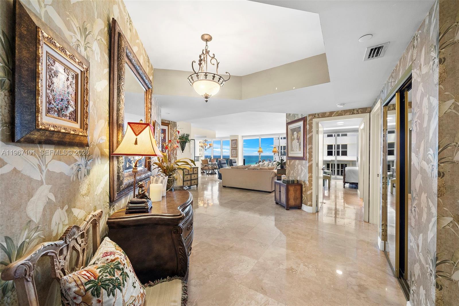 4775 Collins Avenue, Unit 1203 Miami Beach, FL 33140 - Photo 9 of 43 a view of a livingroom with furniture and a livingroom