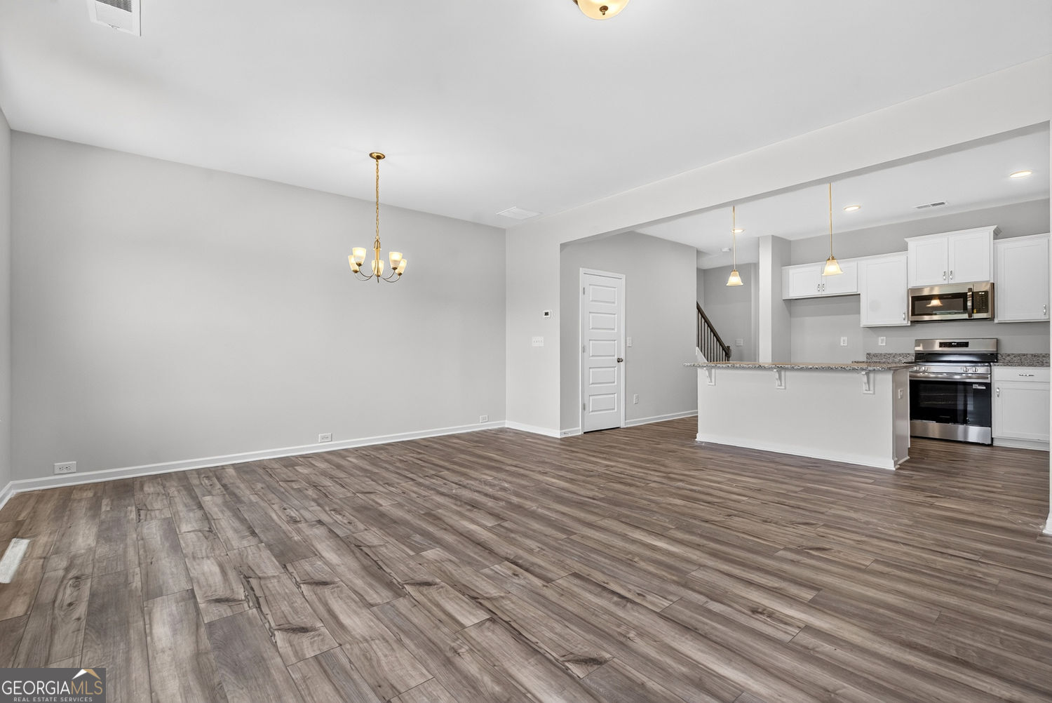 155 Oconee Road, Unit 252 Cartersville, GA 30120 - Photo 10 of 39 a view of a kitchen with furniture and wooden floor