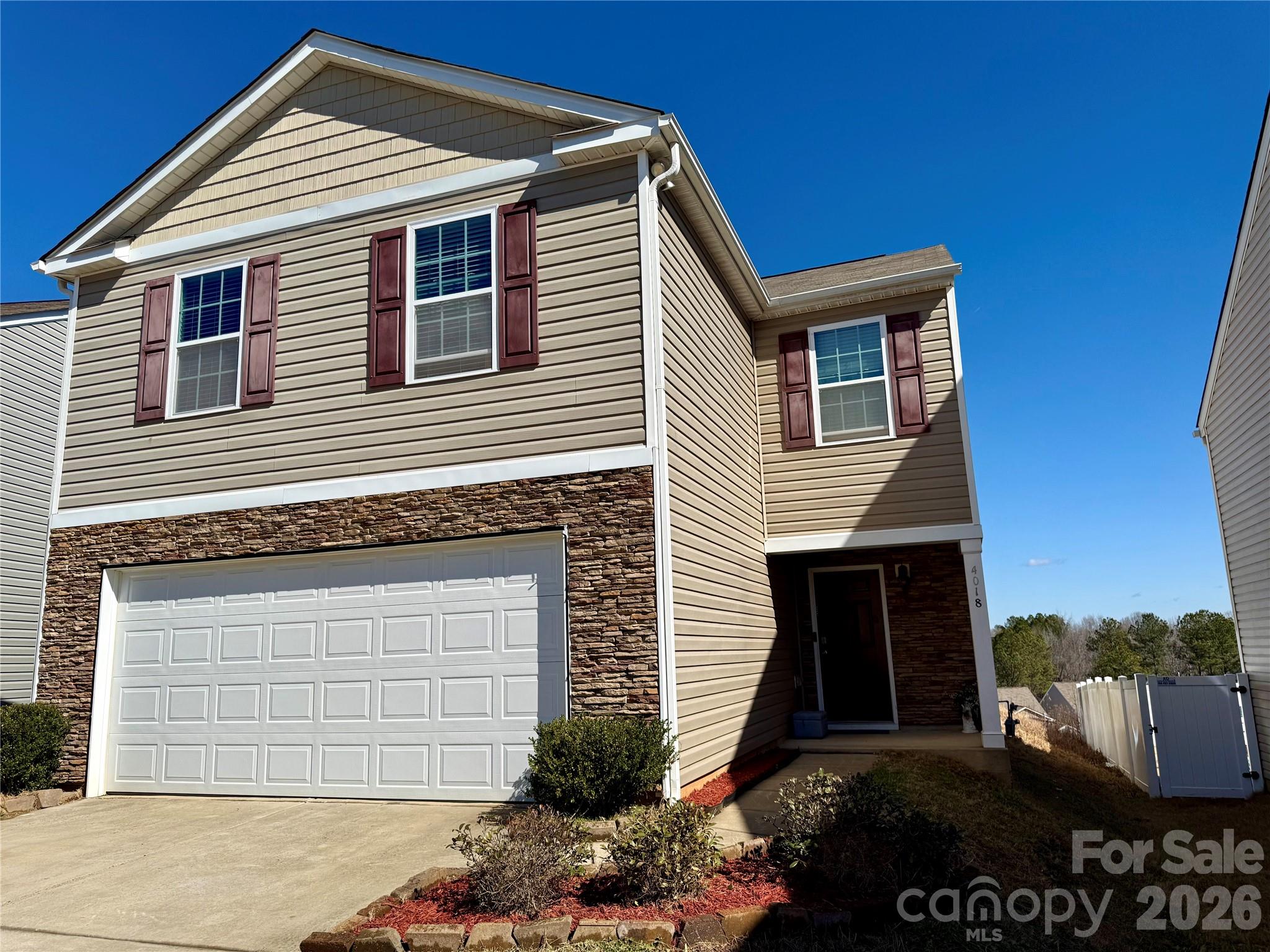 4018 BETHESDA Place Concord, NC 28025 - Photo 1 of 21 a view of a house with a yard