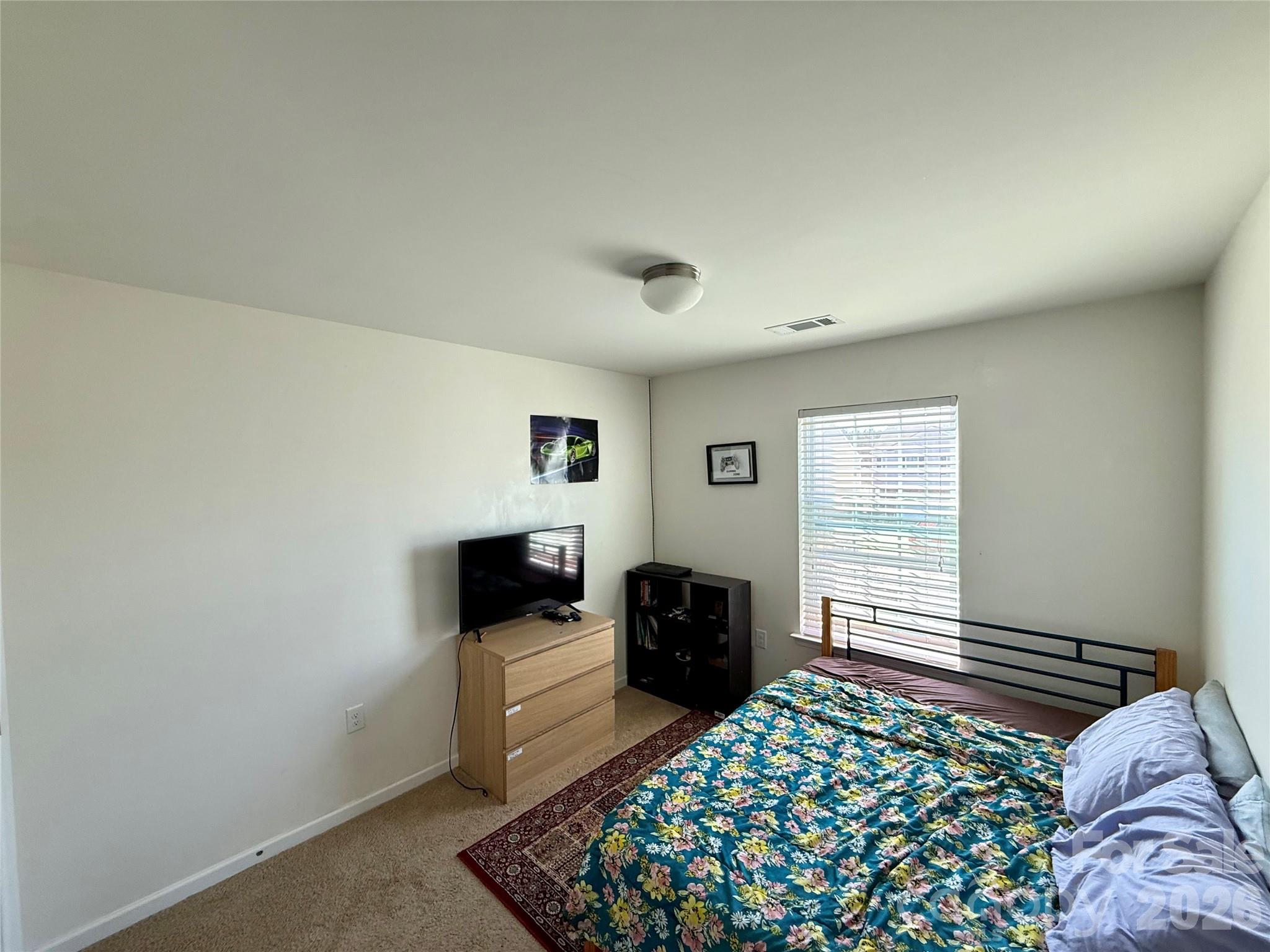 4018 BETHESDA Place Concord, NC 28025 - Photo 11 of 21 a bedroom with a bed and a window