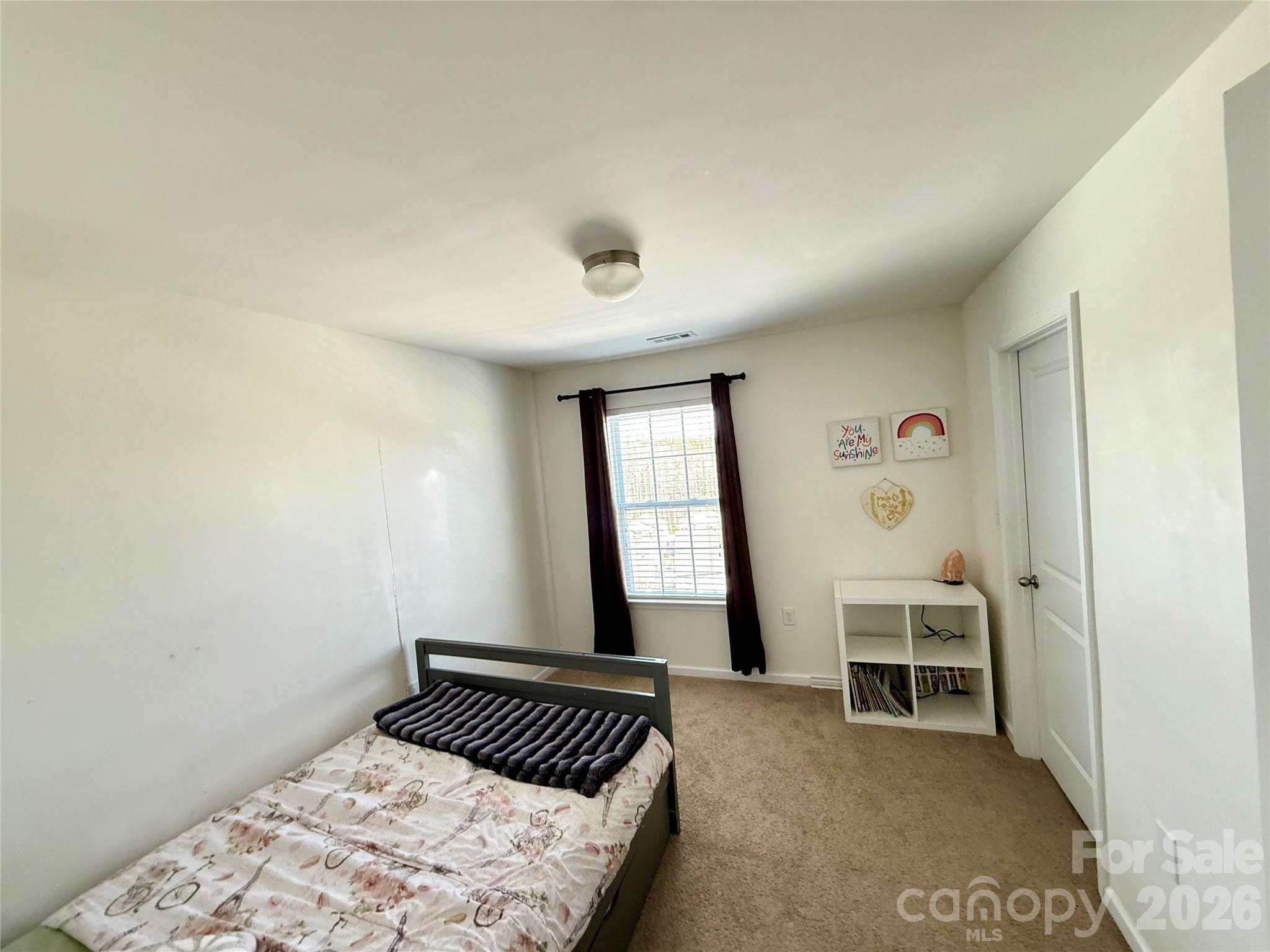 4018 BETHESDA Place Concord, NC 28025 - Photo 18 of 21 a bedroom with a bed and a window