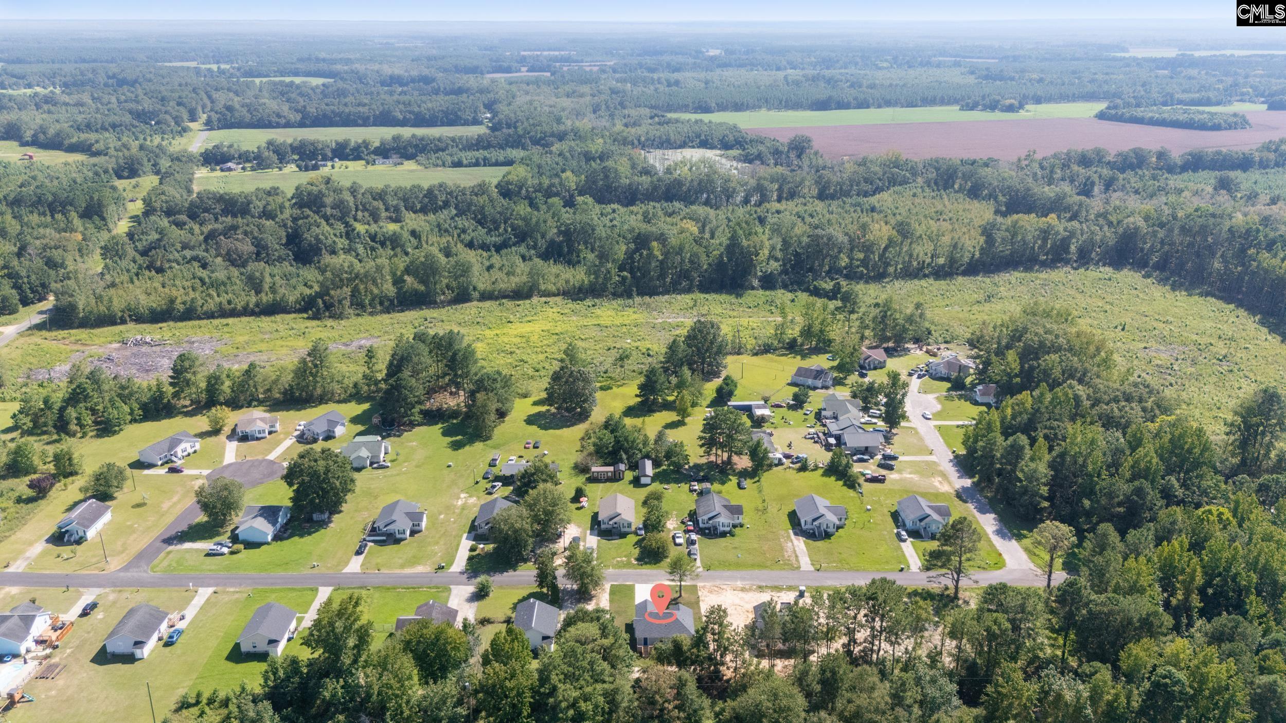 116 Sunny Acres Road Eastover, SC 29044 - Photo 35 of 40 an aerial view of a residential houses with outdoor space and trees all around