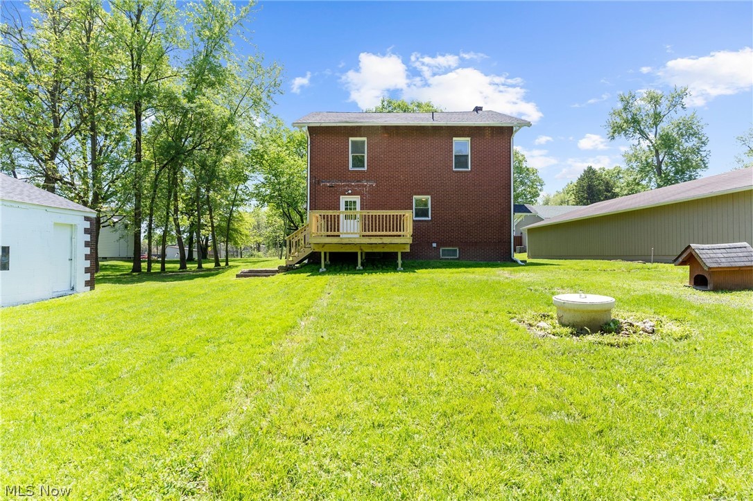 4646 Kirk Road Youngstown, OH 44515 - Photo 5 of 18 Rear view of property with a lawn