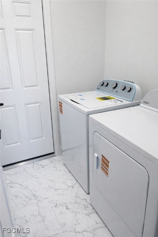 3905 11th Street Southwest Lehigh Acres, FL 33976 - Photo 12 of 12 a utility room with dryer and washer