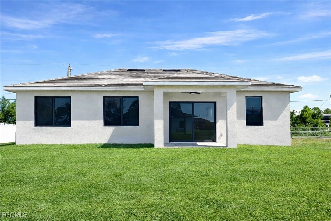 3905 11th Street Southwest Lehigh Acres, FL 33976 - Photo 2 of 12 a front view of a house with a yard