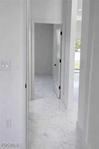 a bathroom with a granite countertop bathtub shower sink vanity mirror and toilet