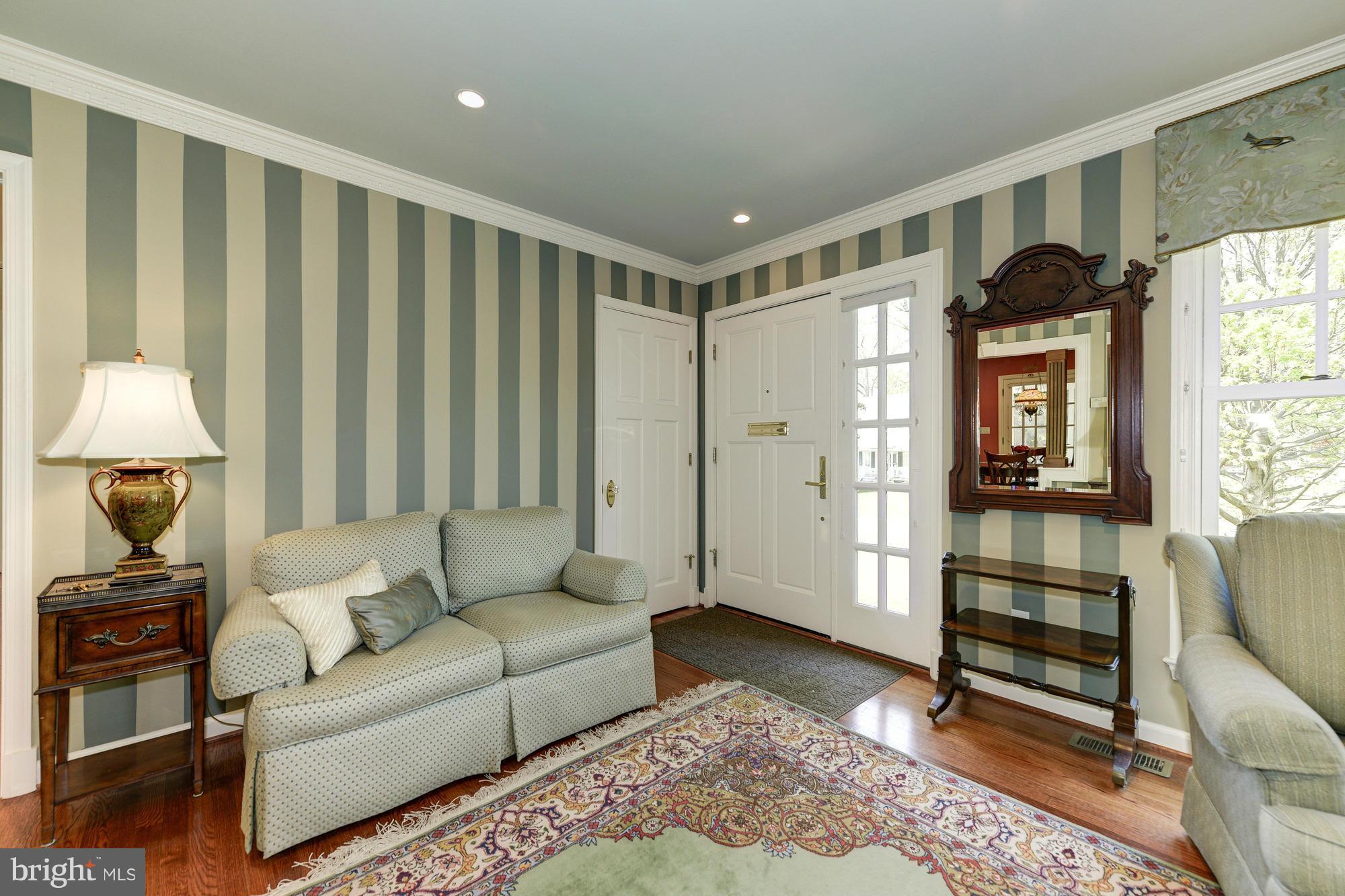 6752 Little Falls Road Arlington, VA 22213 - Photo 3 of 30 a living room with furniture and a window