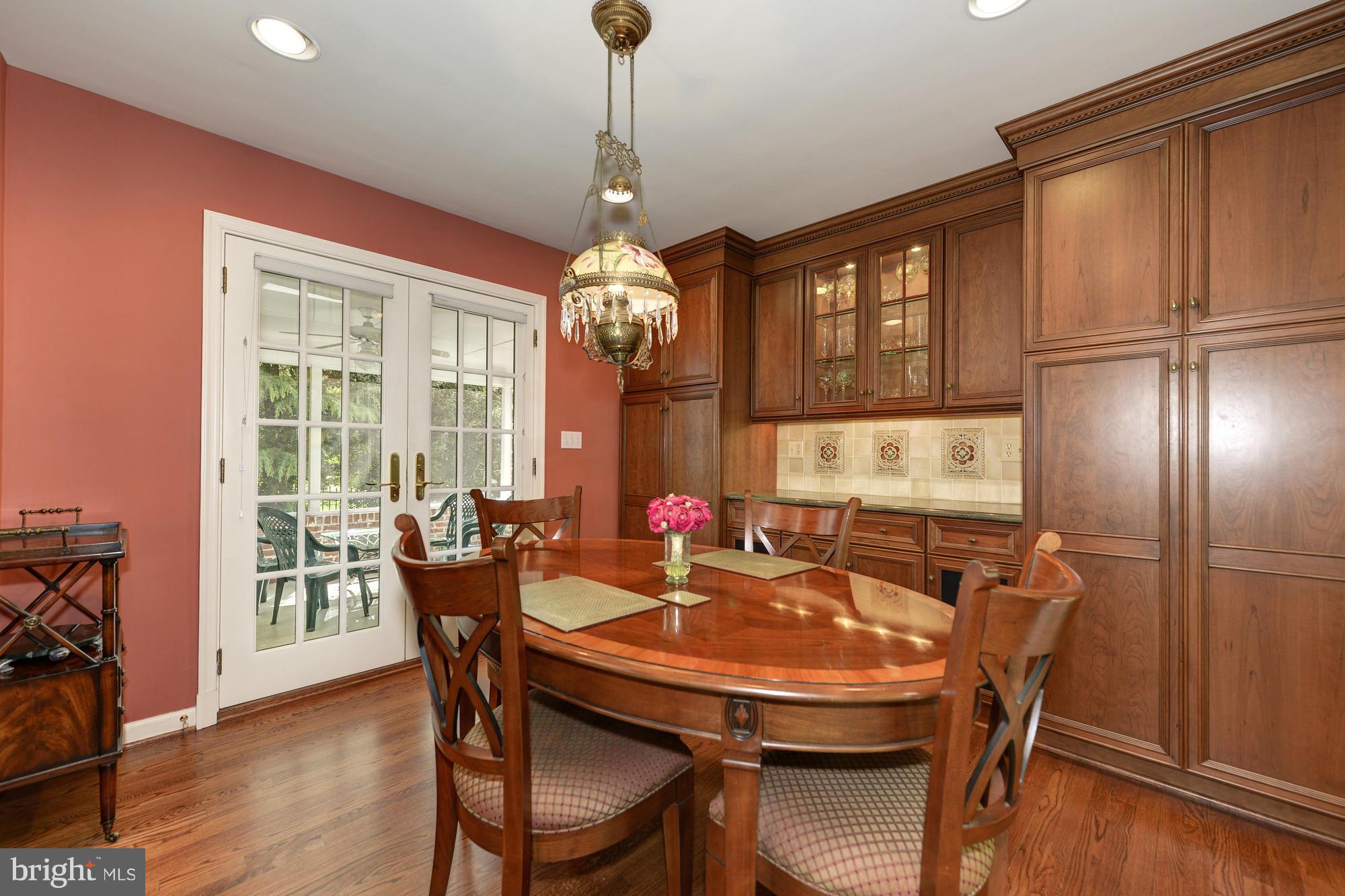 6752 Little Falls Road Arlington, VA 22213 - Photo 8 of 30 a dining room with furniture window wooden floor