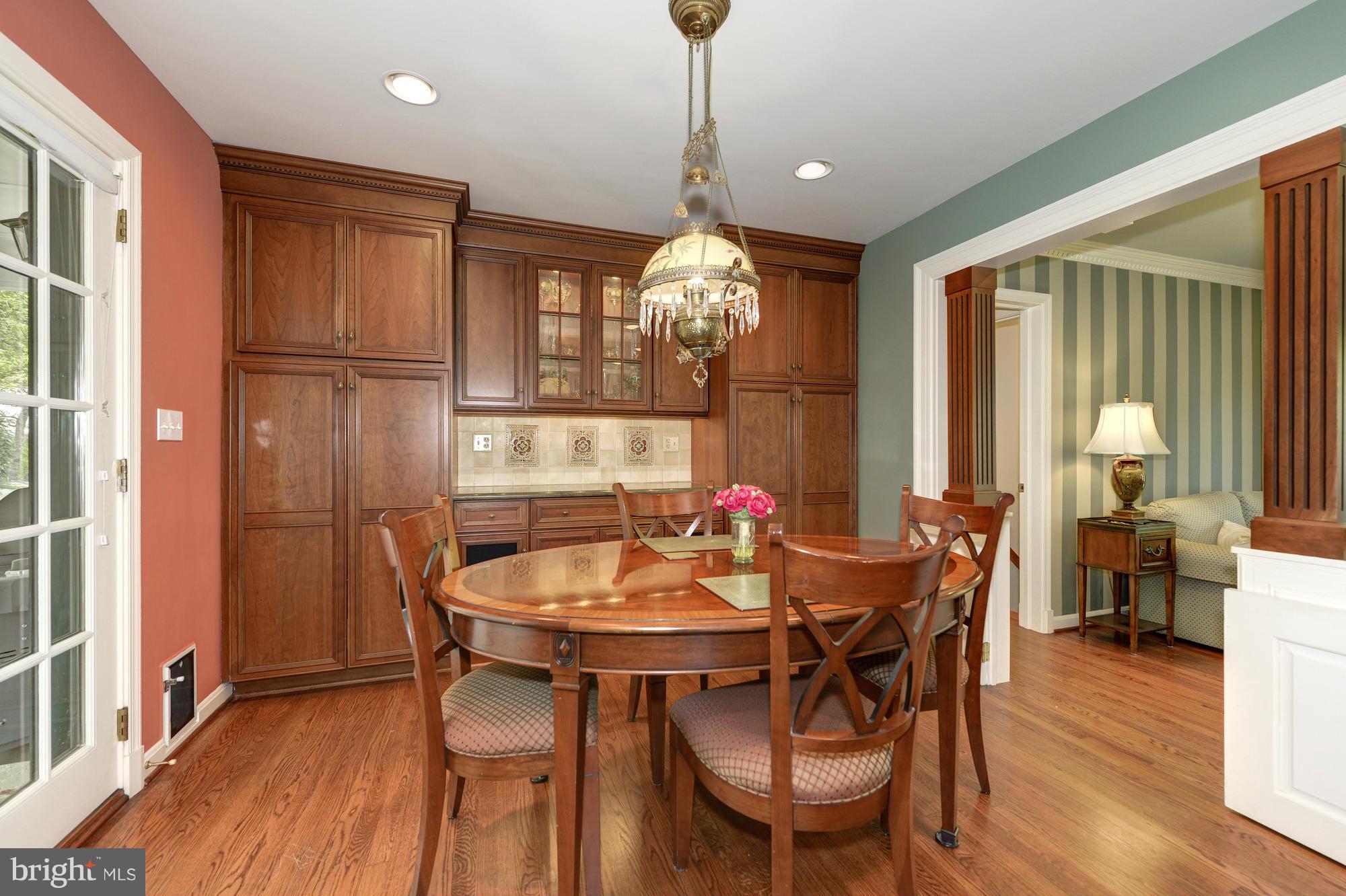 6752 Little Falls Road Arlington, VA 22213 - Photo 9 of 30 a dining room with furniture window wooden floor