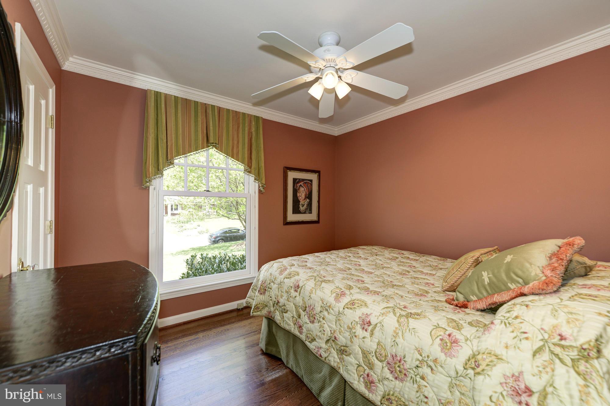 6752 Little Falls Road Arlington, VA 22213 - Photo 10 of 30 a bedroom with a bed and a window