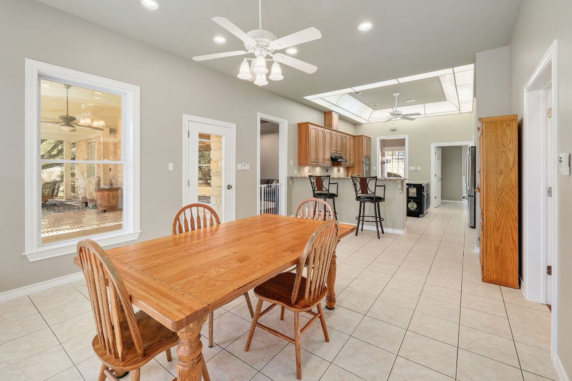 200 High River Ranch Drive Liberty Hill, TX 78642 - Photo 11 of 39 a dining room with furniture a chandelier and wooden floor
