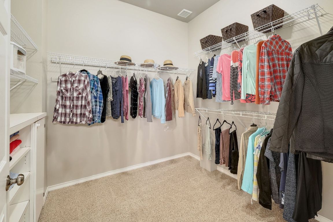 200 High River Ranch Drive Liberty Hill, TX 78642 - Photo 17 of 39 a view of walk in closet with clothes and shoes