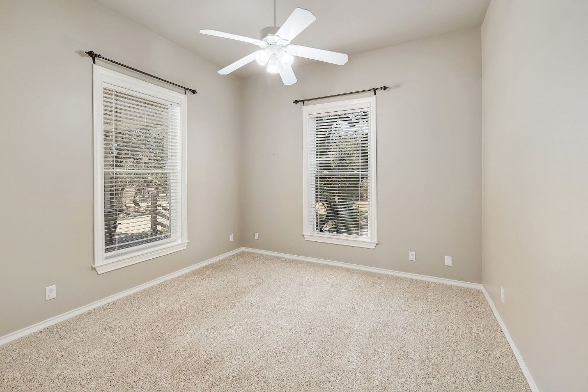 200 High River Ranch Drive Liberty Hill, TX 78642 - Photo 21 of 39 an empty room with windows and fan