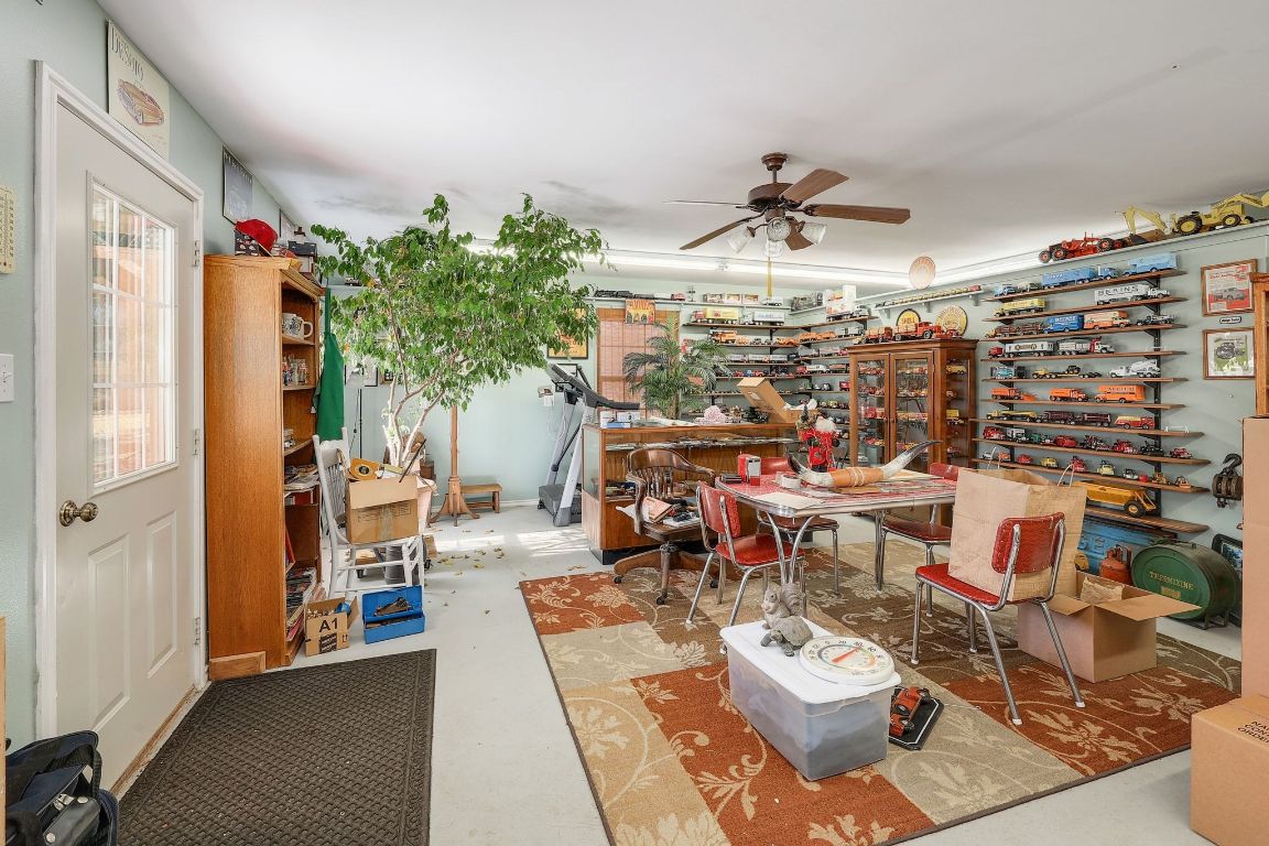 200 High River Ranch Drive Liberty Hill, TX 78642 - Photo 28 of 39 a living room with lots of furniture and a chandelier