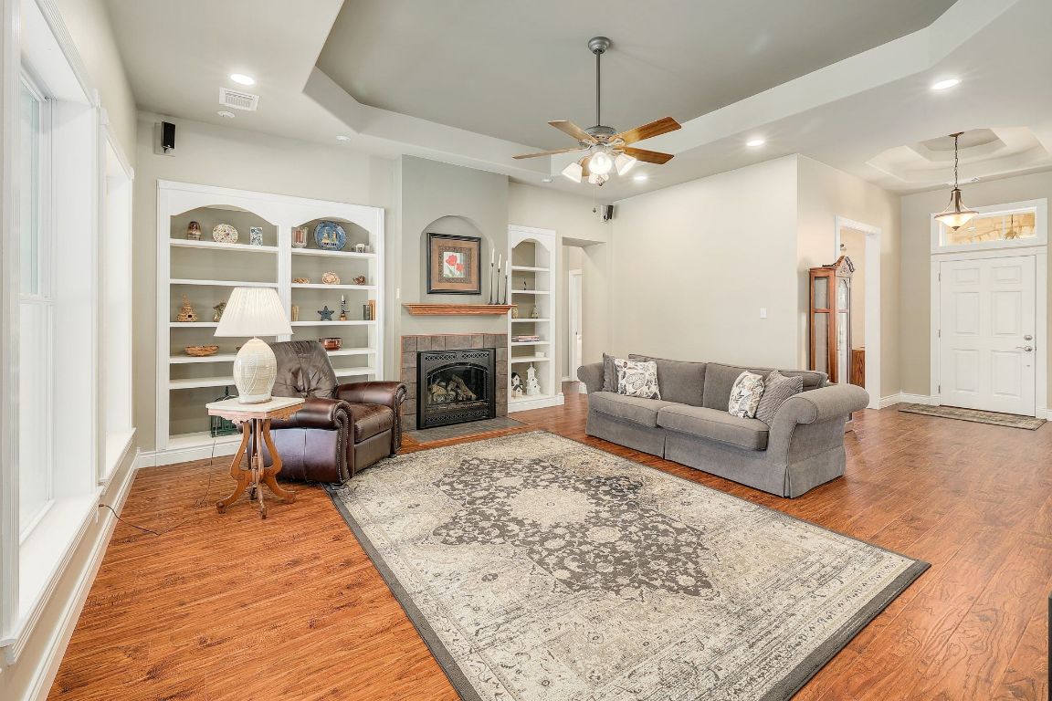 200 High River Ranch Drive Liberty Hill, TX 78642 - Photo 3 of 39 a living room with furniture fireplace and a table