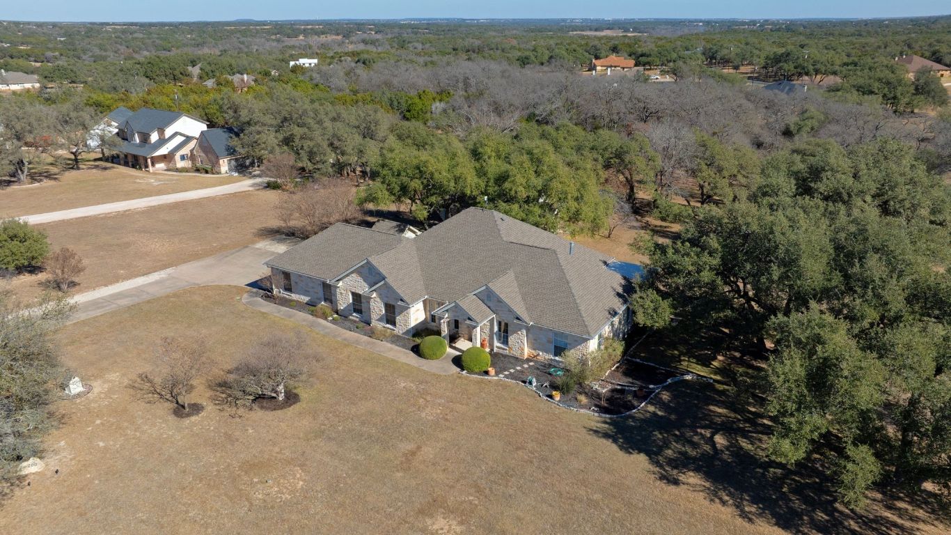 200 High River Ranch Drive Liberty Hill, TX 78642 - Photo 37 of 39 an aerial view of a house with a yard and lake view