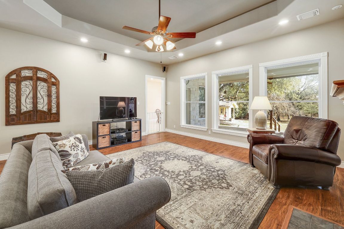 200 High River Ranch Drive Liberty Hill, TX 78642 - Photo 5 of 39 a living room with furniture and a flat screen tv