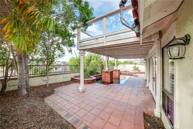 a view of a backyard with sitting area