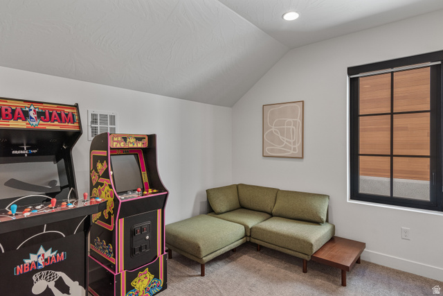 5367 Cyan Lane St. George, UT 84790 - Photo 13 of 49 Attic space featuring a sloped ceiling, recessed lighting, and a black-framed window with integrated blinds
