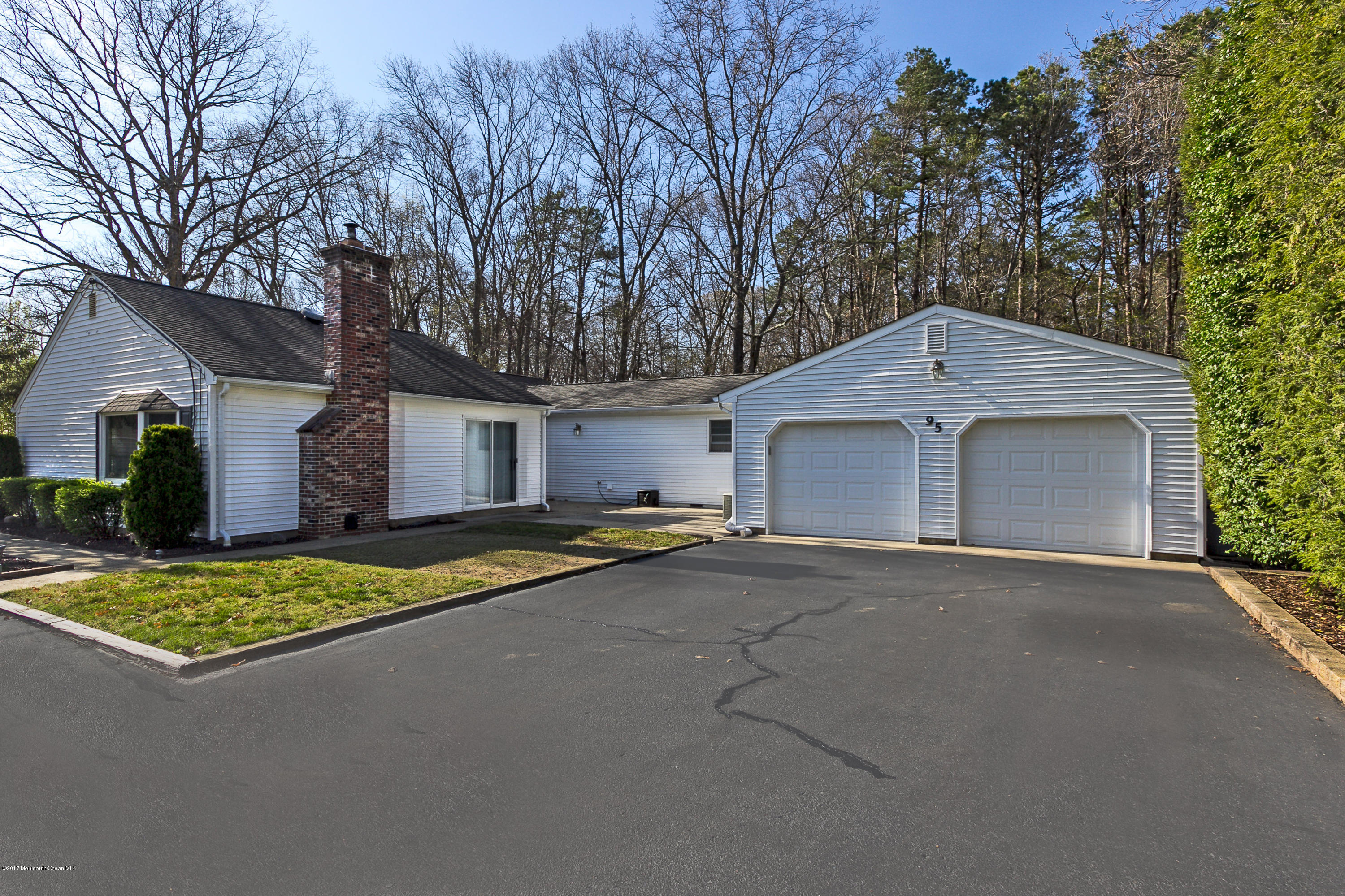 95 Siloam Road Freehold, NJ 07728 - Photo 22 of 23 a house with trees in the background